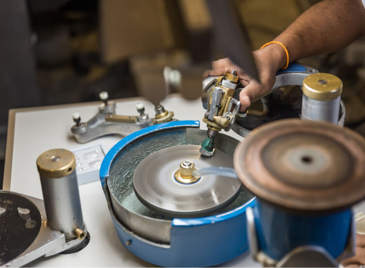 Gemstone being polished on a lapidary wheel